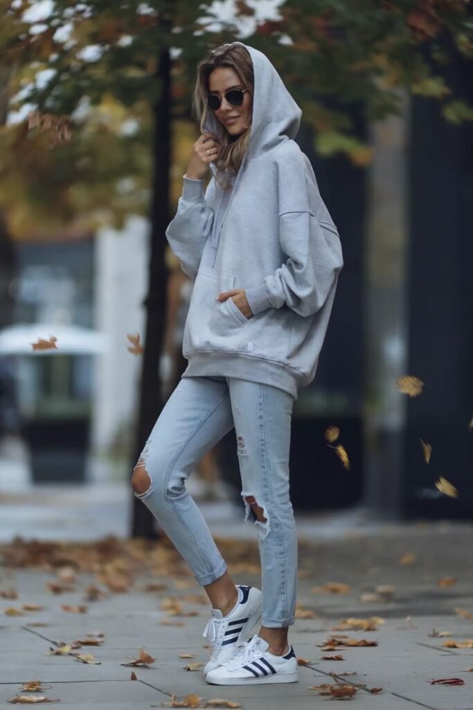 Pastel Hoodie with Ripped Skinny Jeans and Chunky Sneakers